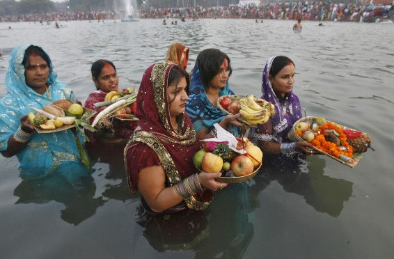 Hindu devotees offer prayers to the Sun god during the Hindu religious festival Chhat