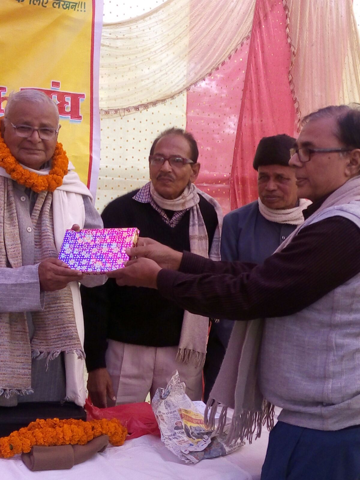 Dr.Madhepuri felicitating Geetkaar Sudhakar Jee .