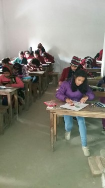 Students writing exam at Parvati Science College