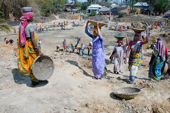 Women digging pond at the village of Madhepura District.