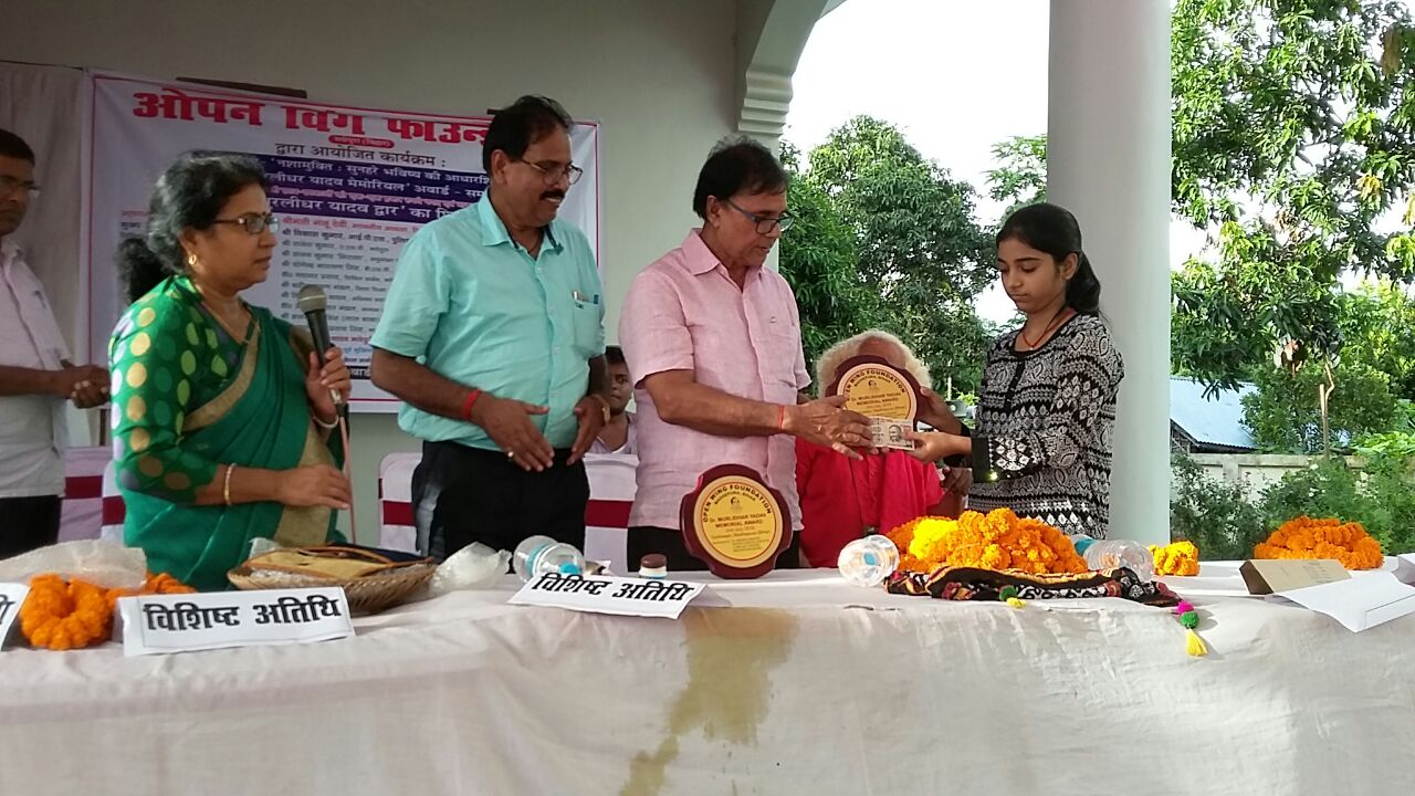 Intermediate District Topper- 2106 Ms.Mayuree receiving Prize & Honour from Physics Stalwart Dr.Bhupendra Madhepuri.