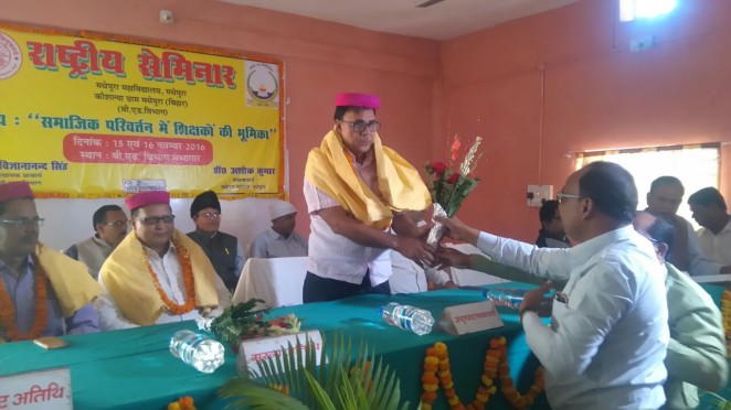 Udghatankarta Dr.Bhupendra Narayan Yadav Madhepuri receiving Pag , Pushpguchh etc by BEd. incharge Dr.Vigyananad Singh in the National Seminar Inaugural Function at Madhepura College Madhepura.