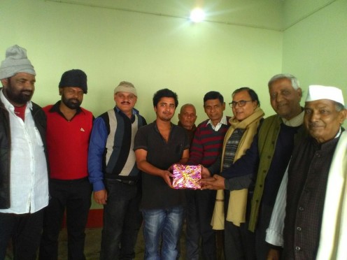 Dr.Bhupendra Madhepuri giving Prize to Kakku Kumar at Radha Krishna Sweets, Jaipalpatti chowk Madhepura in presence of Dhyani Yadav, Principal S.K.Yadav, Army man Dilip Yadav, Prof.Arun Kumar and others .