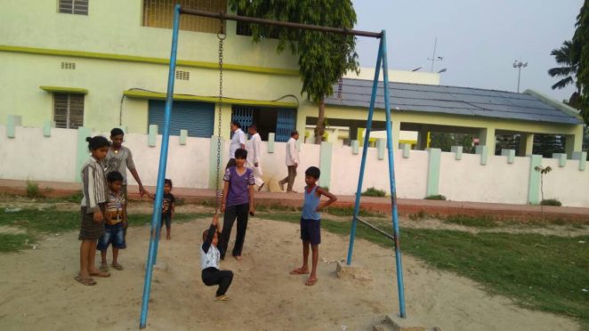 International Karate Player Miss Soniraj watching her niece and other children waiting for their turn near the ruptured swinging rope inside Circuite House Park at Madhepura.