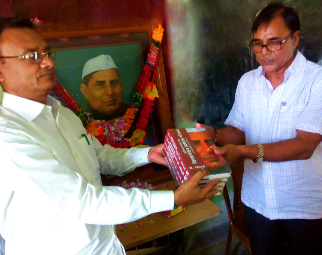 Dr.Bhupendra Madhepuri (Author of Itihas Purush Shiv Nandan Mandal), donating books to the school library of SNMP +2 High School, Madhepura. 