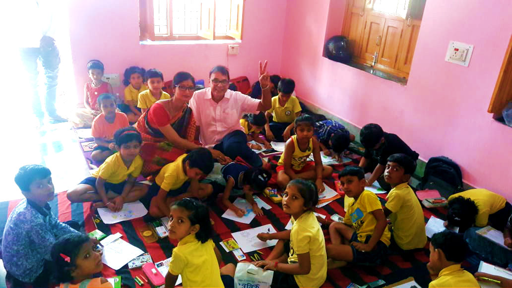 Dr.Madhepuri & Principal Dr.Hema Kashyap amidst kids.