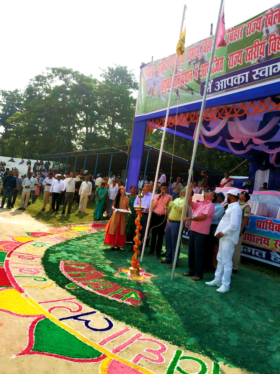 DM Navdeep Shukla & Samajsevi Dr.Bhupendra Madhepuri unfurling the State & District Rugby Flags at BN Mandal Stadium Madhepura.