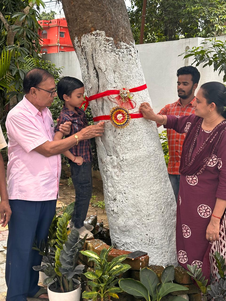 Dr.BhupendraMadhepuri along with Dr.Rashmi Bharti, Akshat, Bikash and Gajen tying Rakhi to tree on the occasion of Ramsha Bandhan at VrindavanMadhepura. 